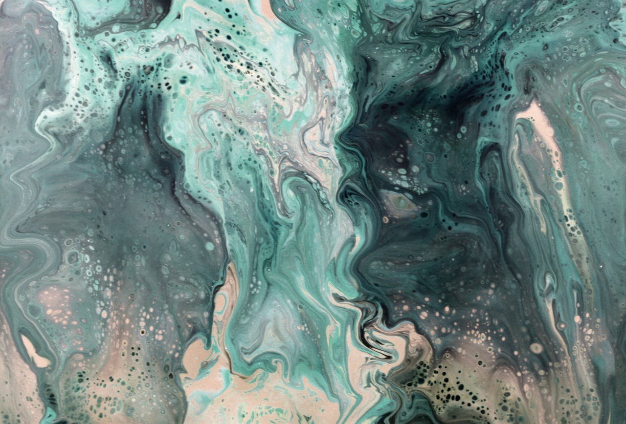 Dynamic turquoise and cream abstract fluid art pattern with flowing, swirling textures.